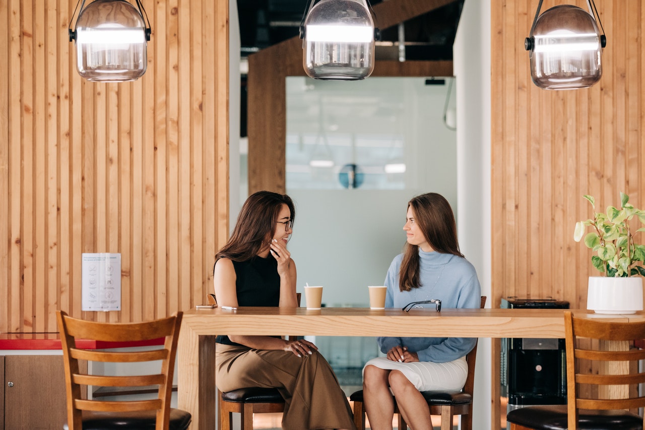 Two insurance agency workers talking about culture