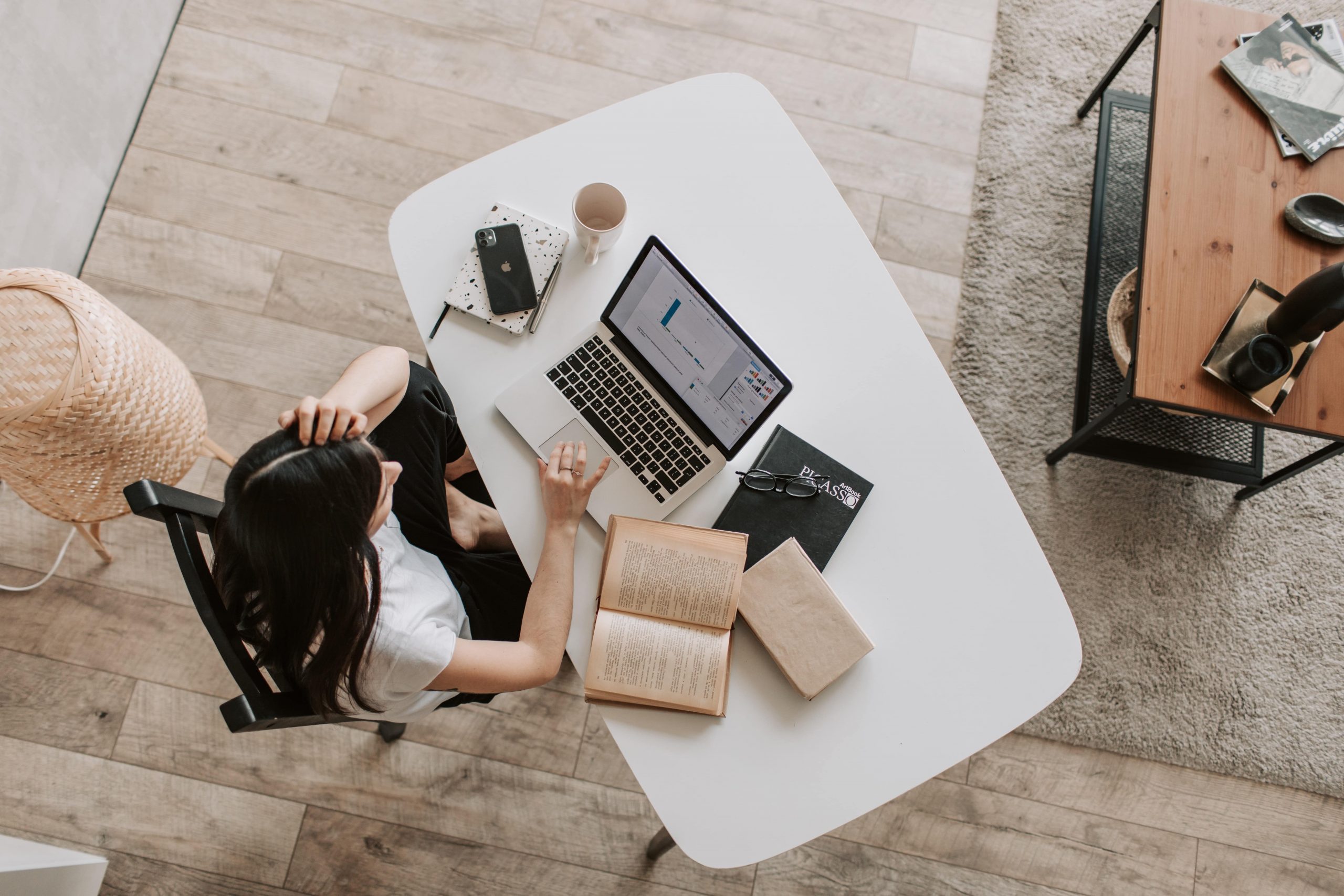 Woman working at a desk as seen from above