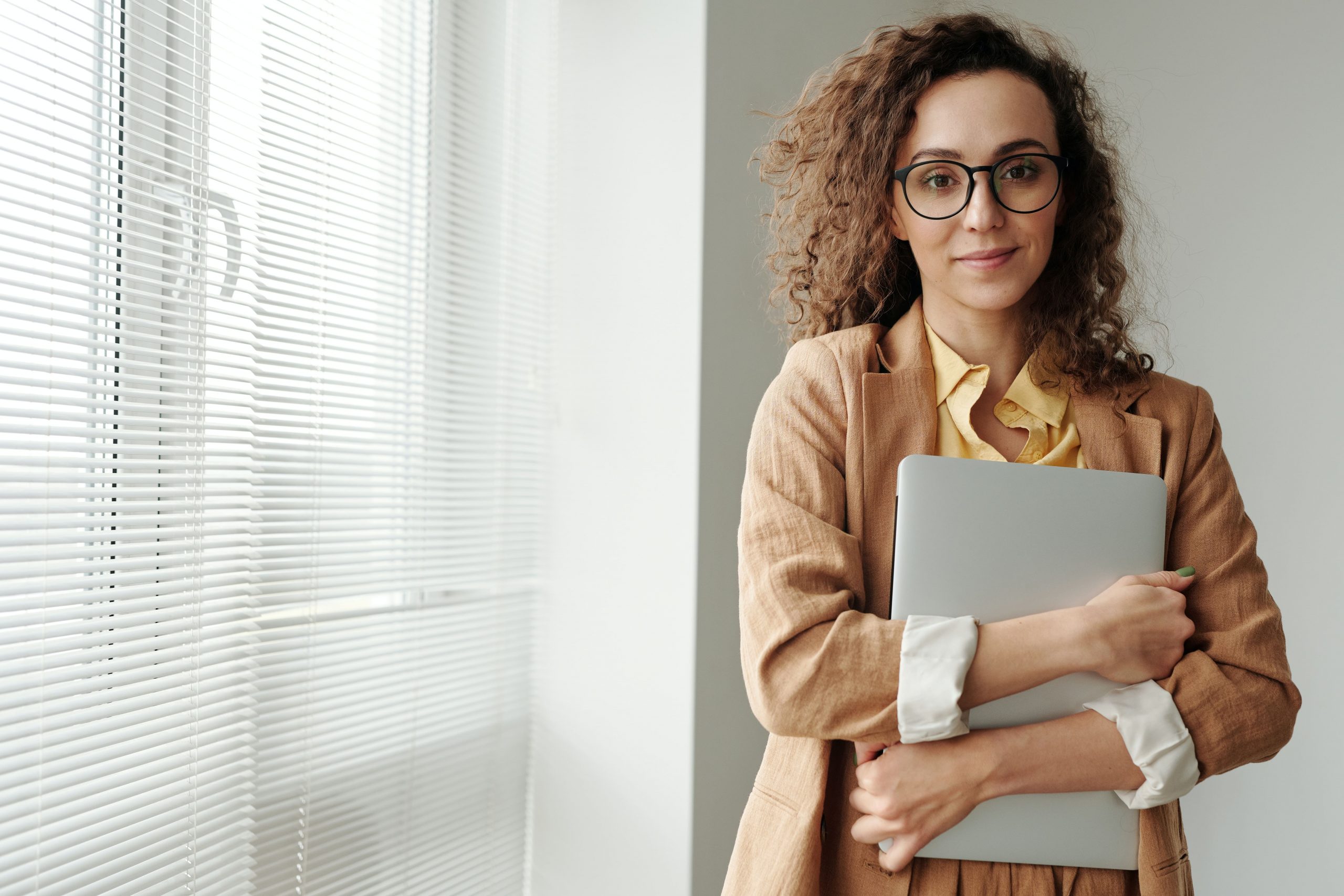 Determined woman holding laptop