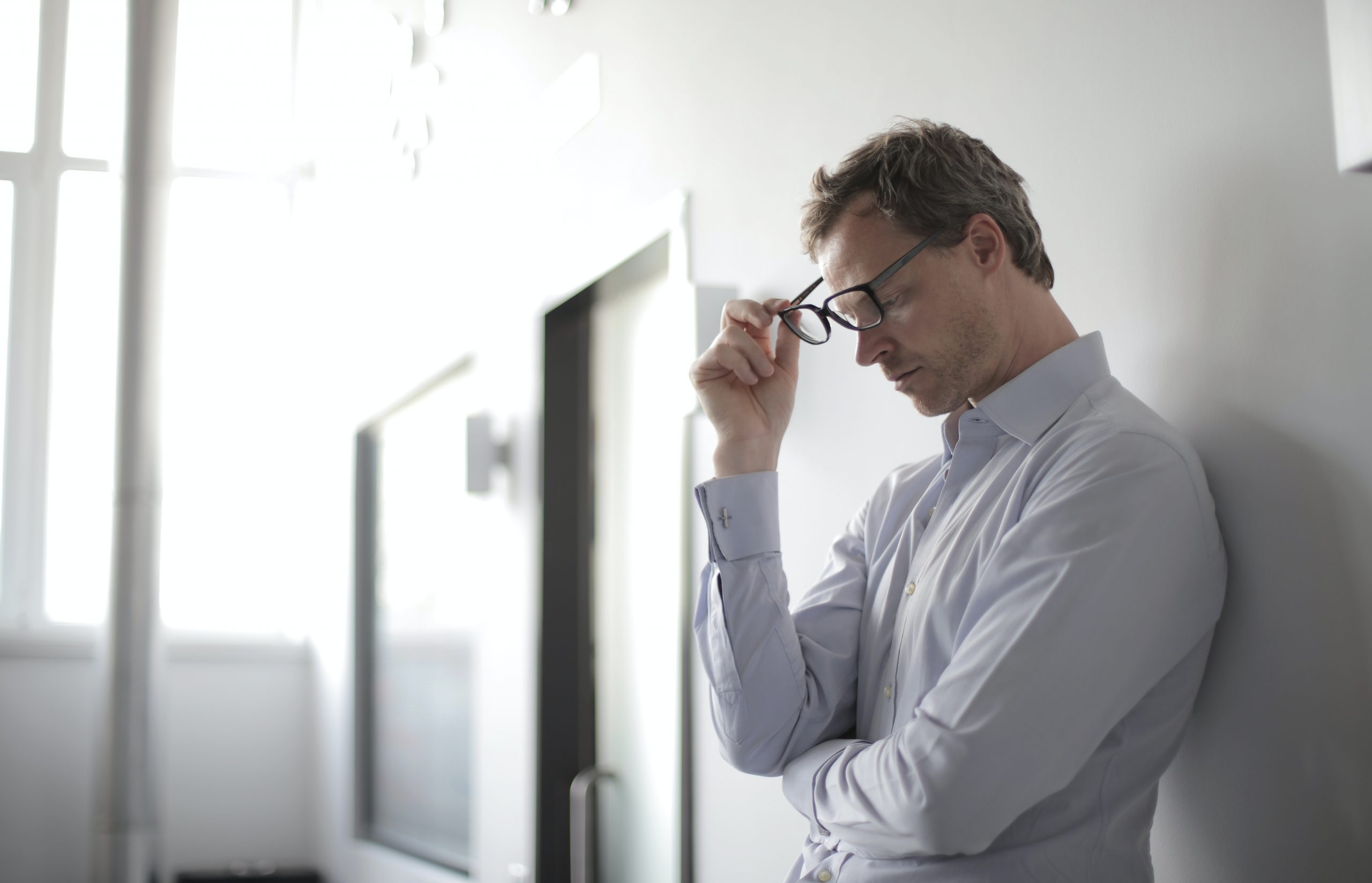 Stressed Insurance Agent Contemplates Their Biggest Career Mistake