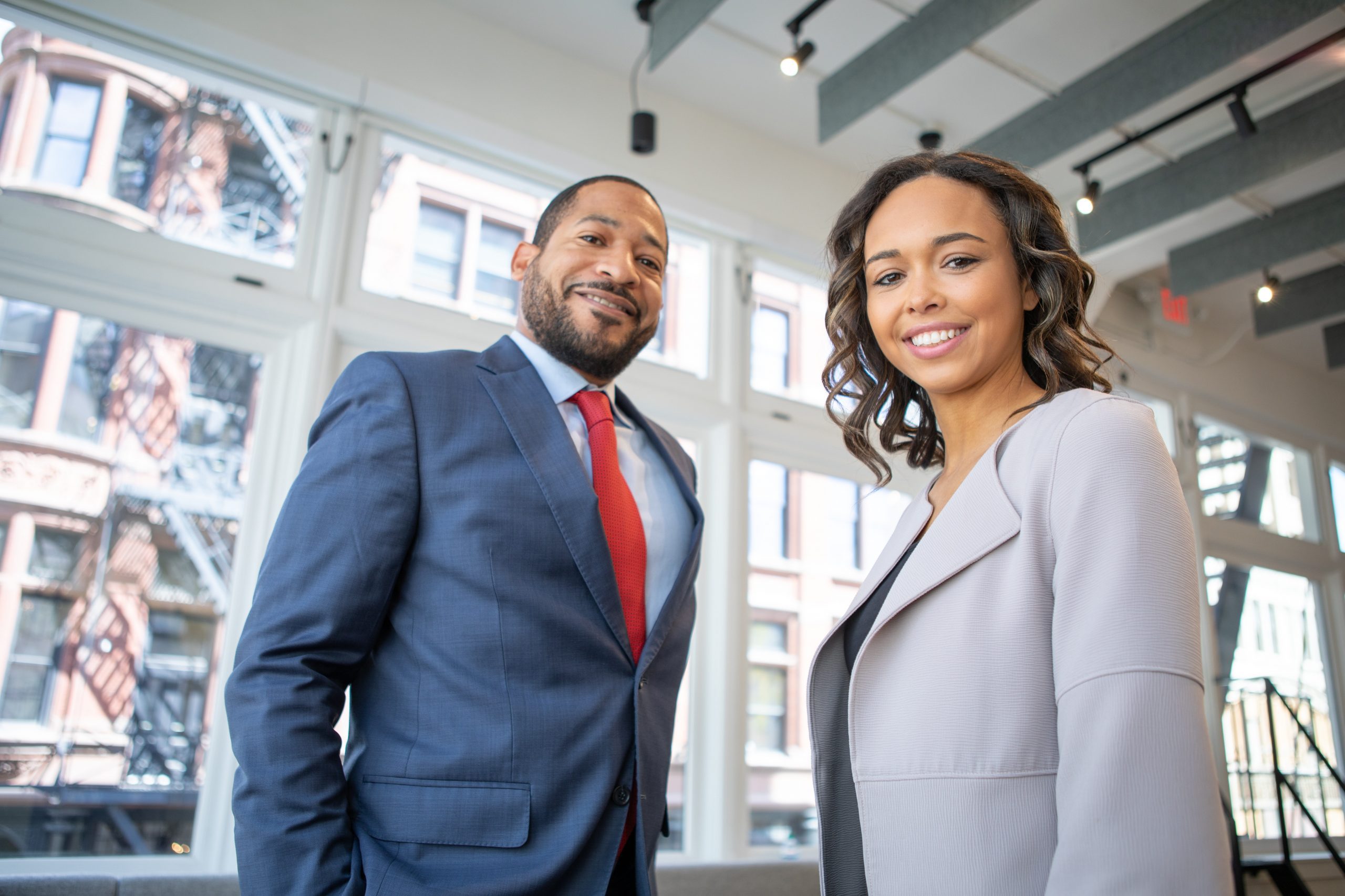 Smiling Man and Woman insurance agency owners and business partners